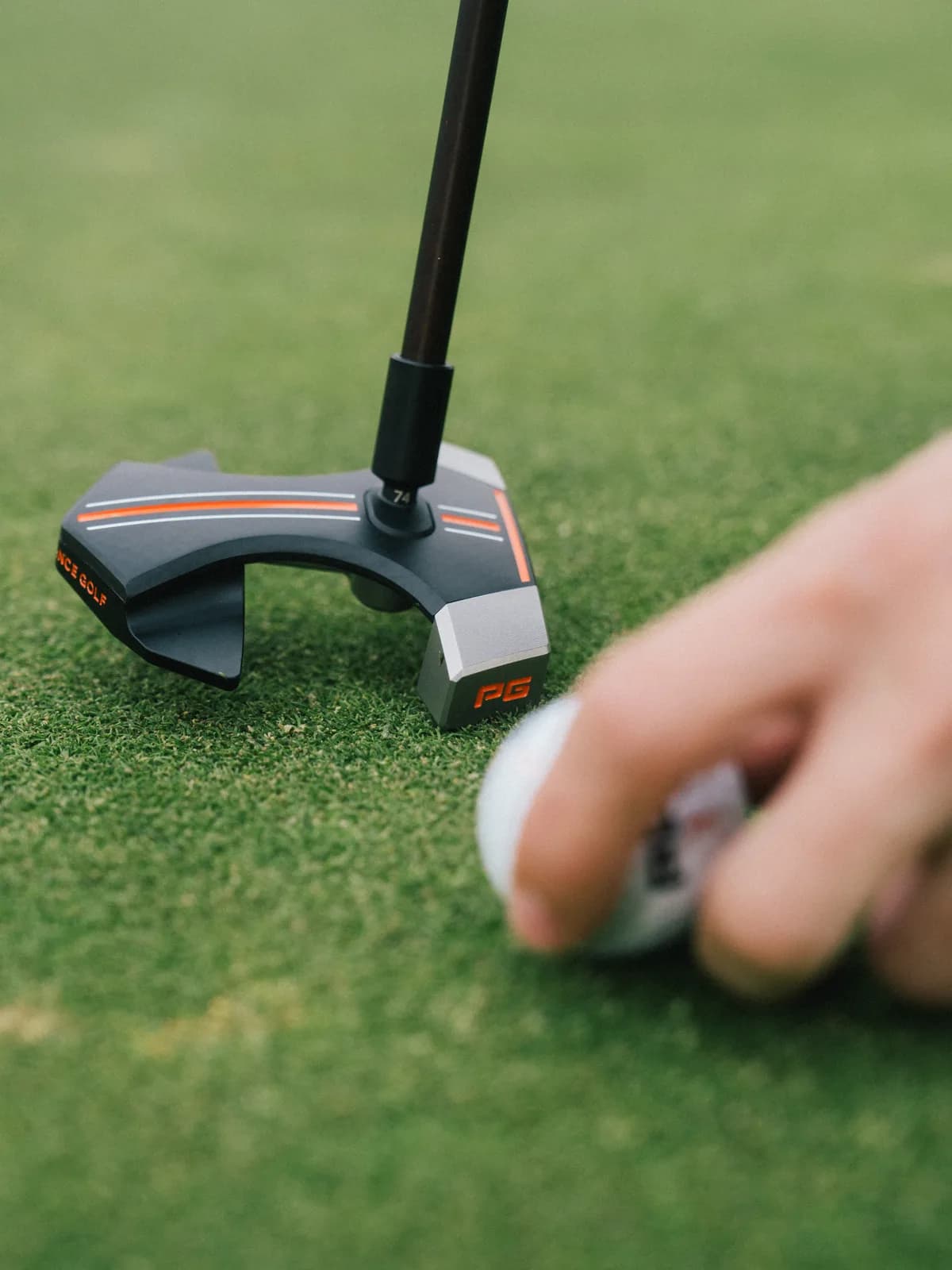 RS1 putter behind ball on the green