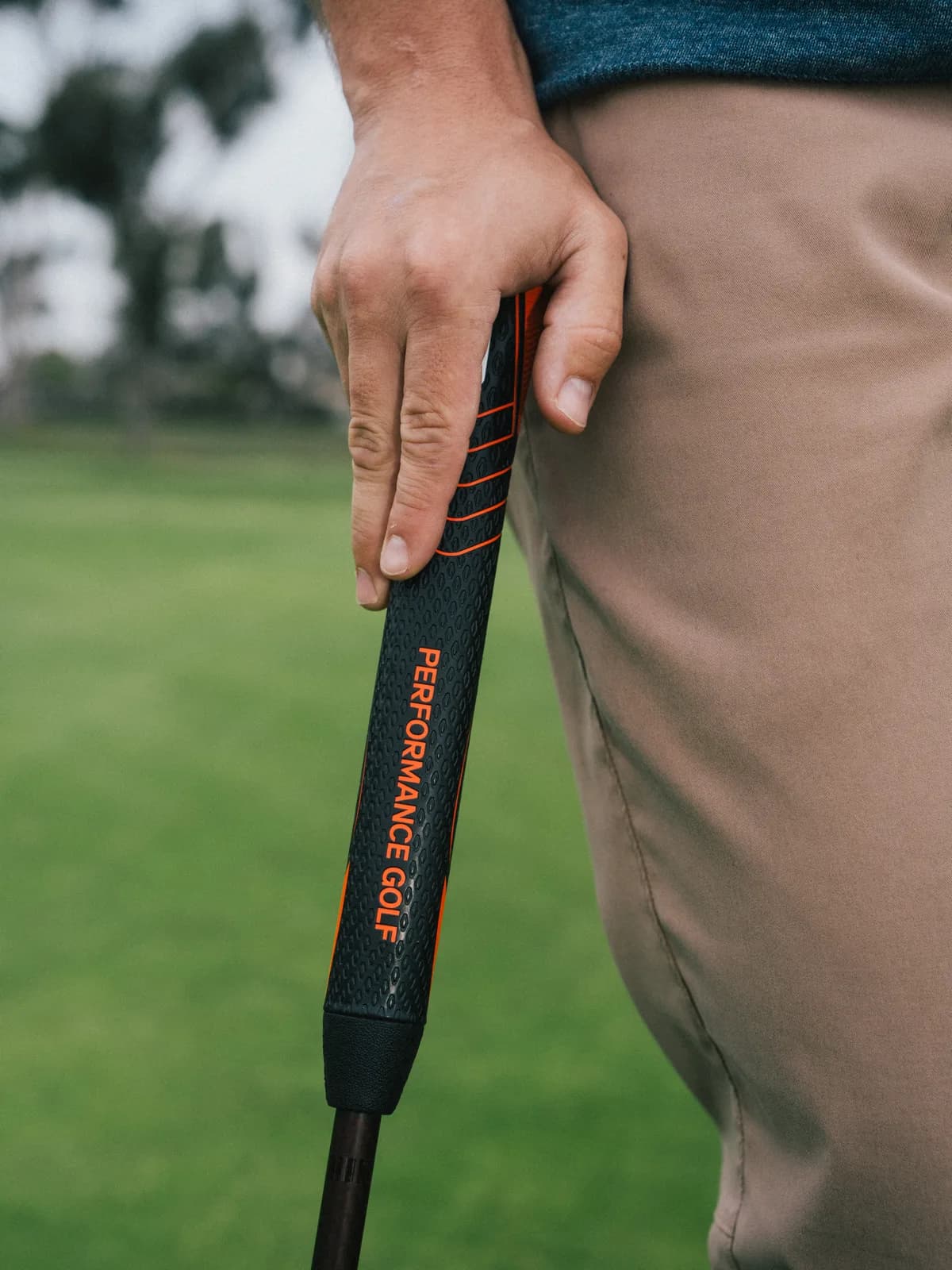 Golfer holding RS1 Dual Pistol grip