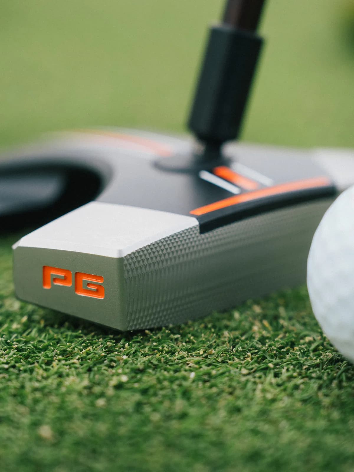 CNC-milled face insert with PG branding and diamond texture