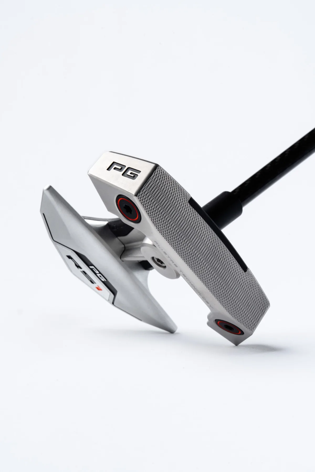 RS1 putter studio shot showing multi-material construction and weight ports