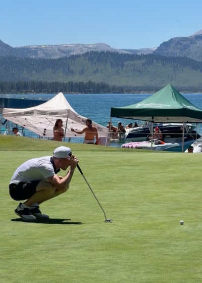Reading a putt on a lakeside green