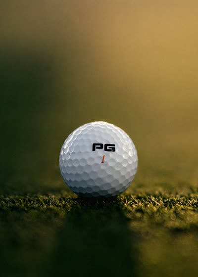 iON+ ball on the turf in golden-hour light