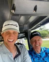 Grant in a cart with his dad