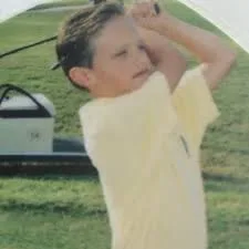 Grant as a kid mid-swing