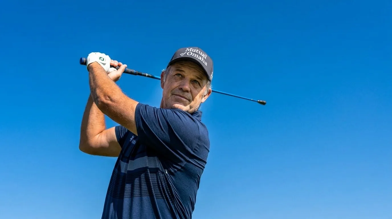 Golfer holding a traditional speed stick at the top of his finish